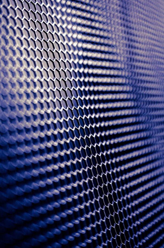 pexels-photo-3653997 Close-up of a futuristic metallic hexagonal pattern, perfect for tech designs.